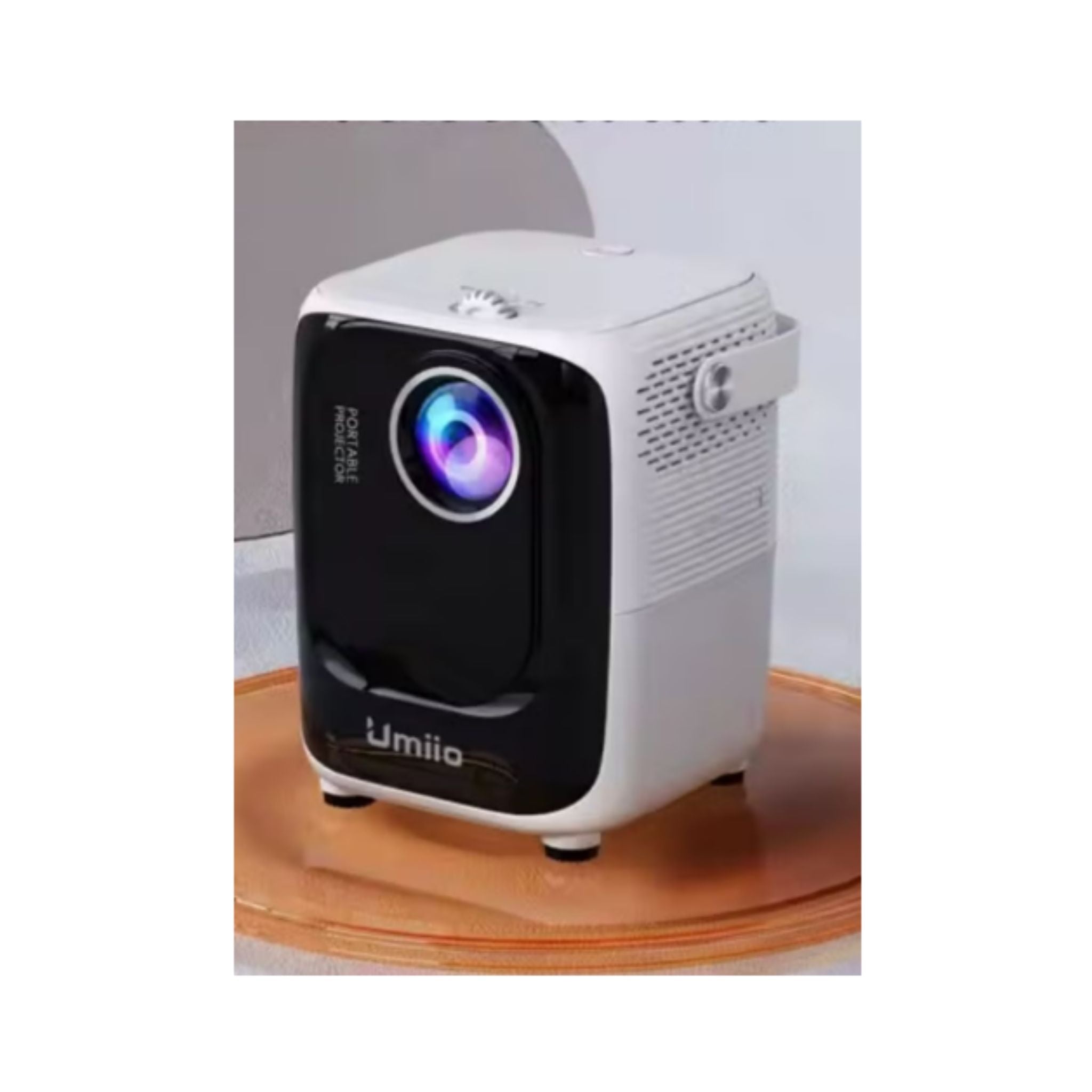 White and black projector on a wooden surface with a light gray background