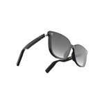 A pair of Porodo Lifestyle polarized sunglasses with a black frame and dark lens, featuring built-in speakers and push-button controls.