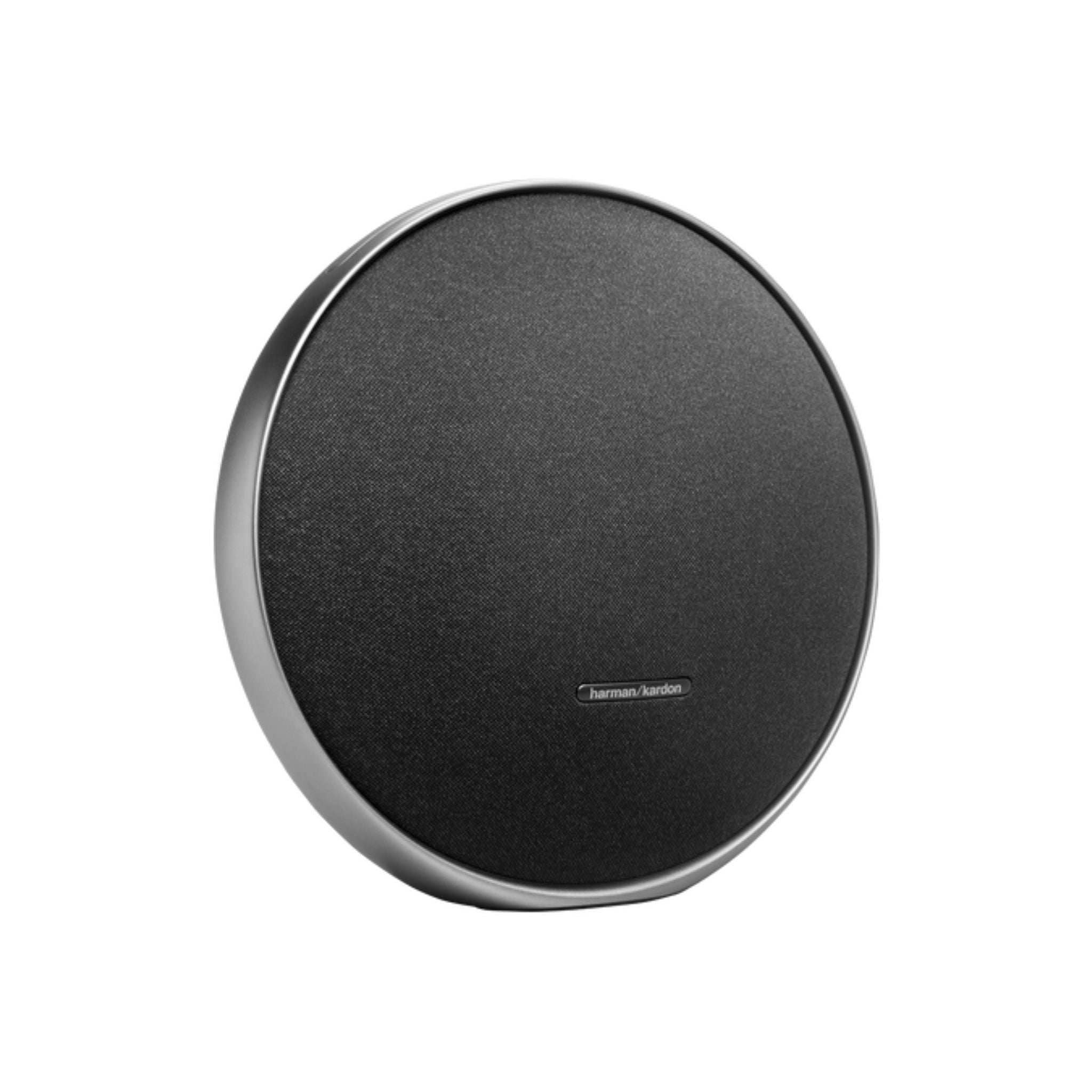 Round black speaker with silver rim on a white background