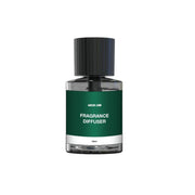 An elegant Green Lion fragrance diffuser in a black and green glass bottle with a black cap, labeled 'FRAGRANCE DIFUSER'.