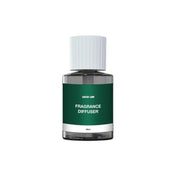 A white and green glass fragrance diffuser bottle with a white cap and label that reads 'FRAGRANCE DIFFUSER'.