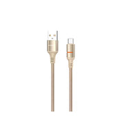 Gold USB cable with braided design on a white background