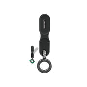 A black Green Lion brand MagSafe car holder with a flexible neck and a green accent, including a detachable loop for keychains or bags.