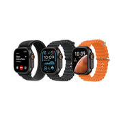 Four smartwatches with different colored bands on a white background