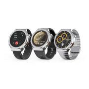 Three smart watches with round shaped AMOLED displays, featuring silver cases and black straps. The watches show time and date, with one displaying a phone icon indicating Bluetooth capability.