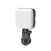 White light modifier with black clip on a white background