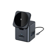 A black 9-in-1 hub docking station with multiple ports, including USB and Ethernet, and a wireless charging pad on top.