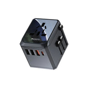 Gray travel adapter with multiple ports on a white background