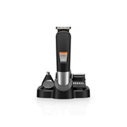 A black Green Lion men's grooming kit with a stainless steel blade and a 4 comb guard, featuring an LED display and a charging base.