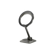 A black foldable MagSafe car holder made of zinc alloy and PC material, with a strong magnet for securing a smartphone, displayed on a stand.